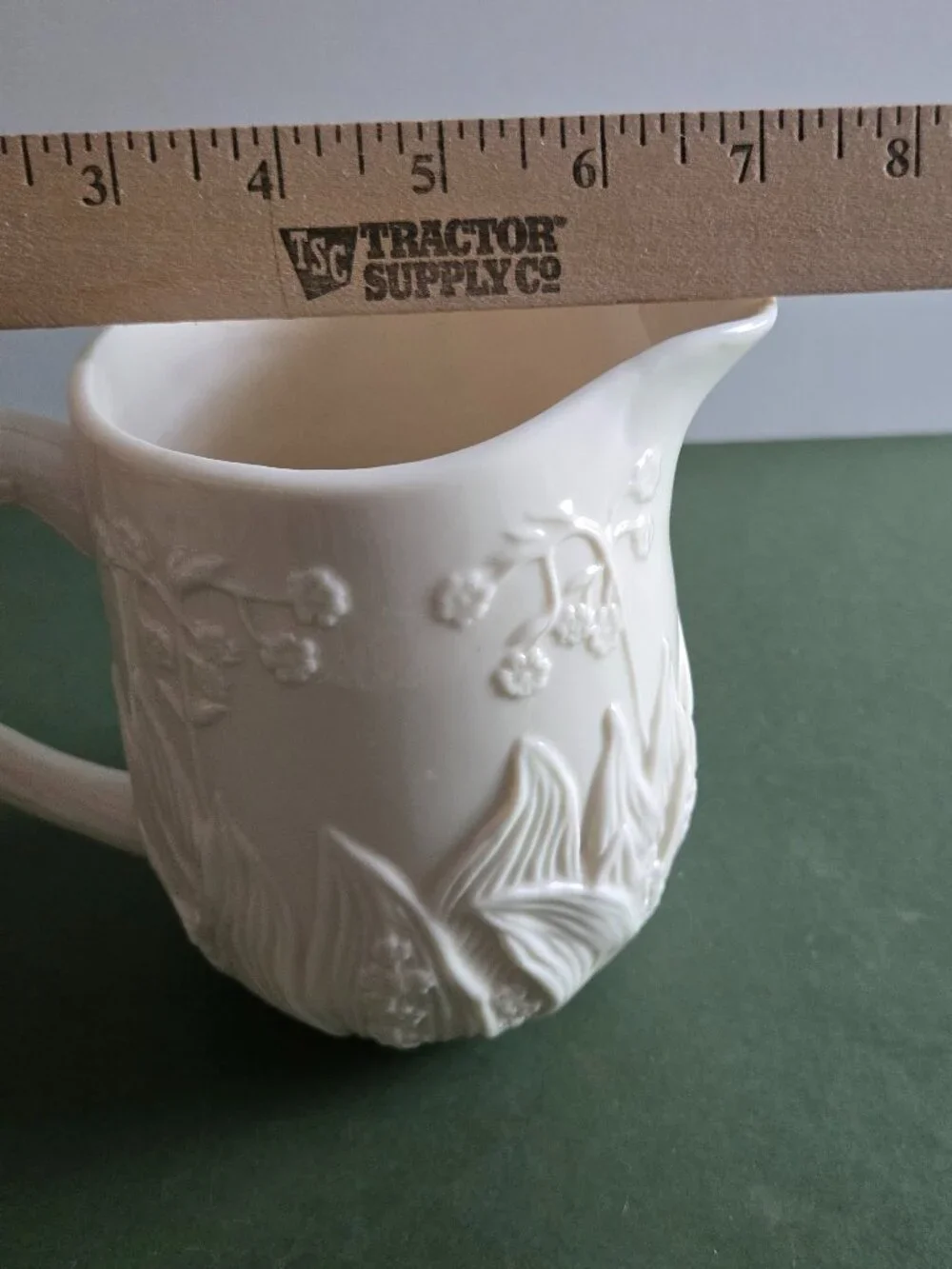 Pair of Ivory Bisque Pitchers